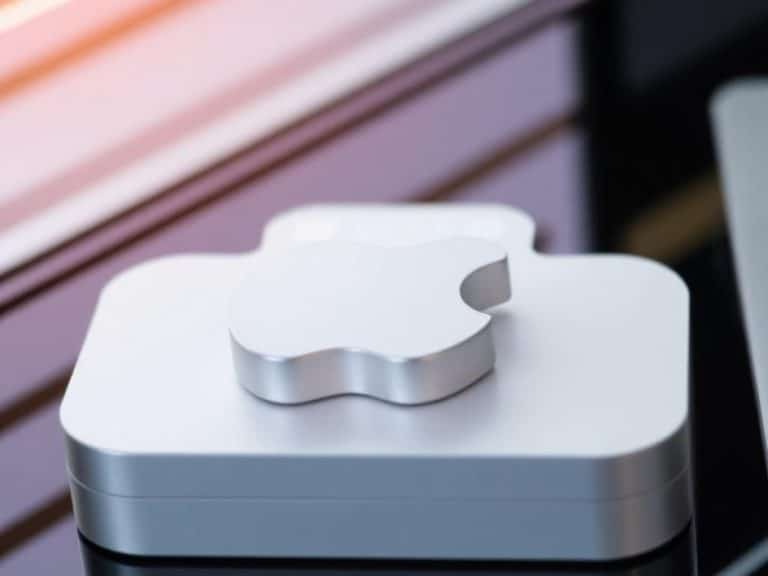 iPhone 13 Pro, Apple Watch, and AirPods shown against yellow background