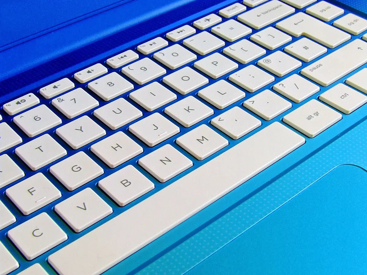 Gaming laptop showing smooth plastic chassis and rounded cooling indent