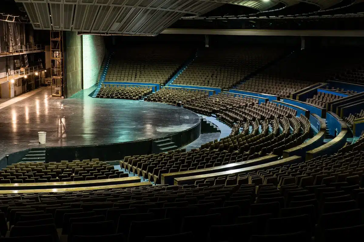 Sleek stage with podium and spotlight in modern auditorium, ready for a major tech presentation