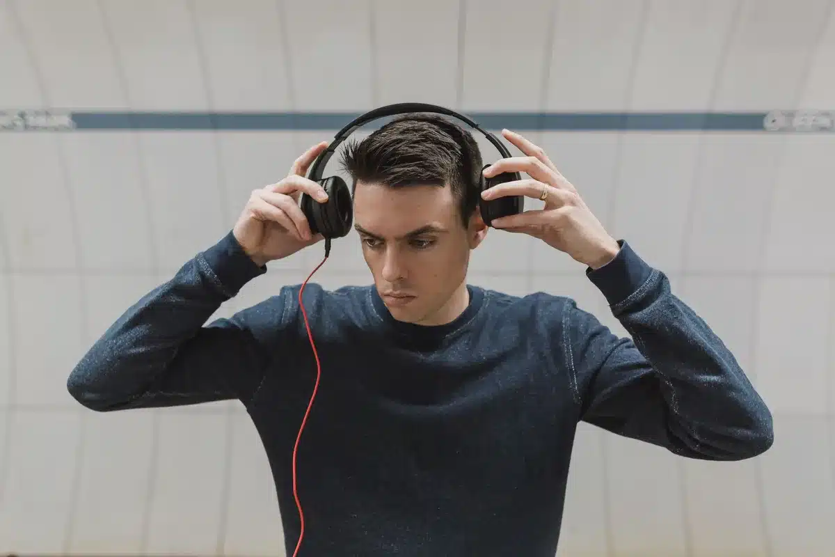 Someone wearing headphones and enjoying music with a relaxed expression