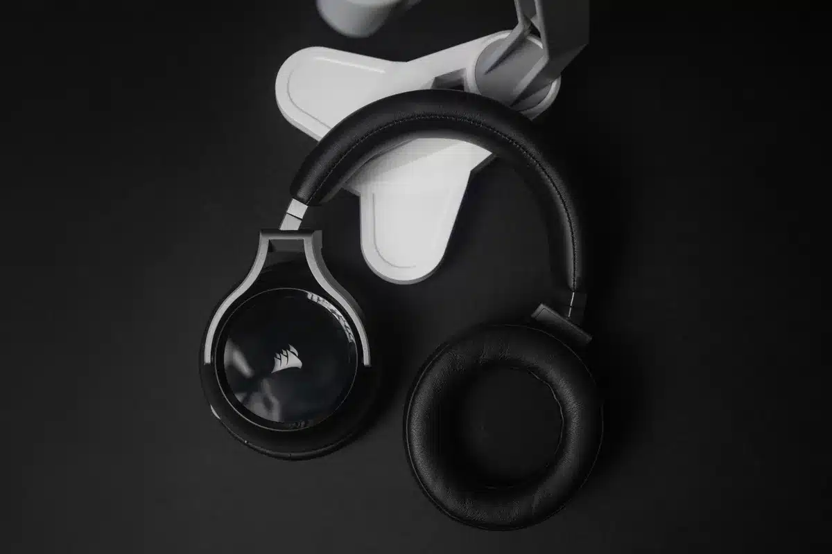 Close-up of someone wearing comfortable over-ear headphones with rounded design and cushioned ear pads
