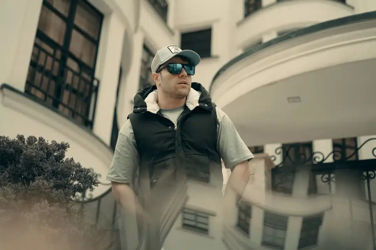 Person wearing a cooling technology vest in everyday clothing during warm weather