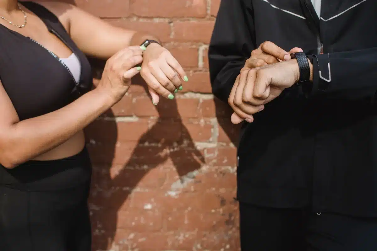 Fitness tracker worn on wrist showing rectangular design and premium aluminum casing