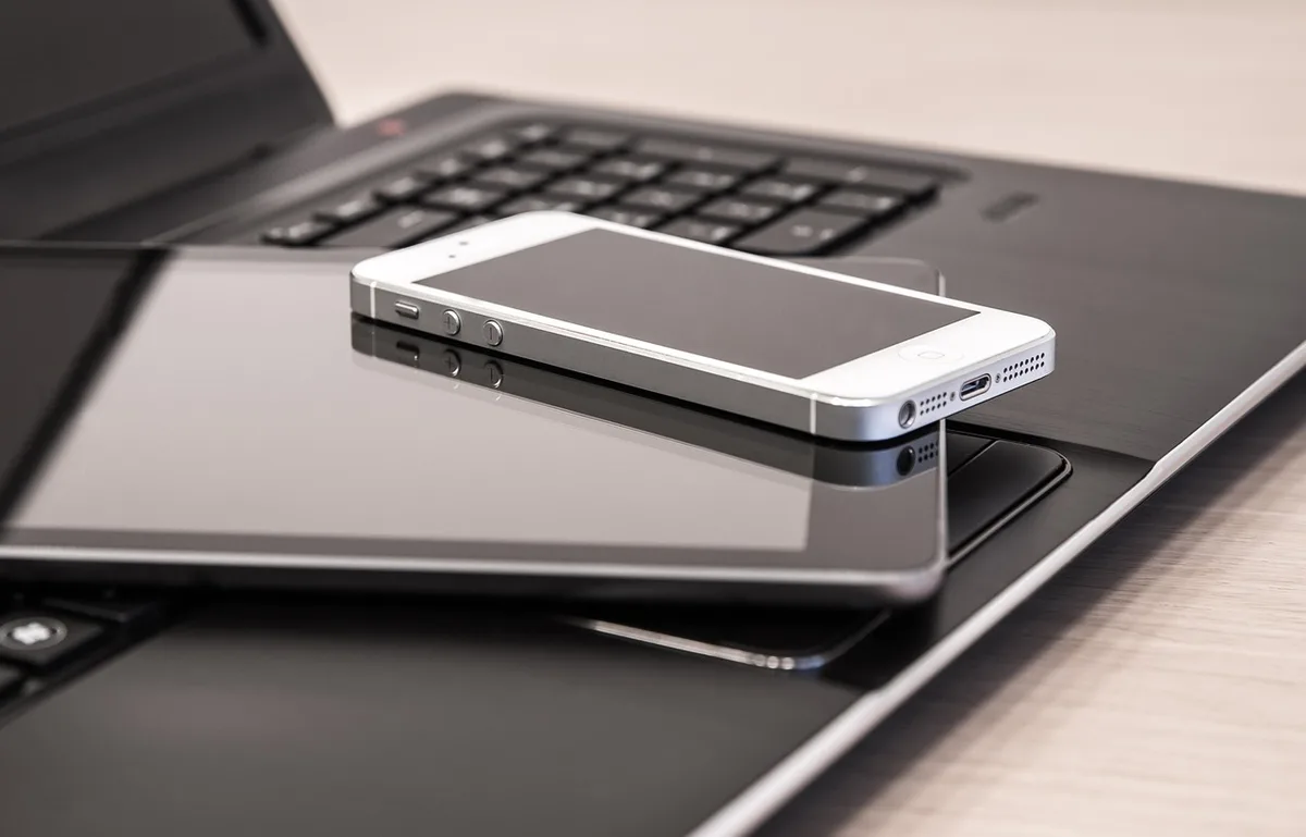 Tablet on a table with a rotatable kickstand supporting vertical orientation
