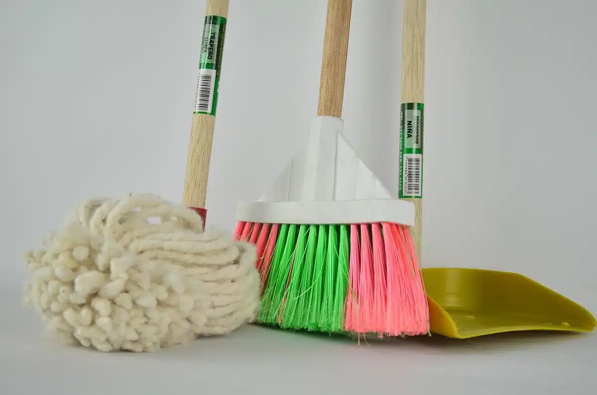 Robot vacuum station washing mop pads with water tanks visible