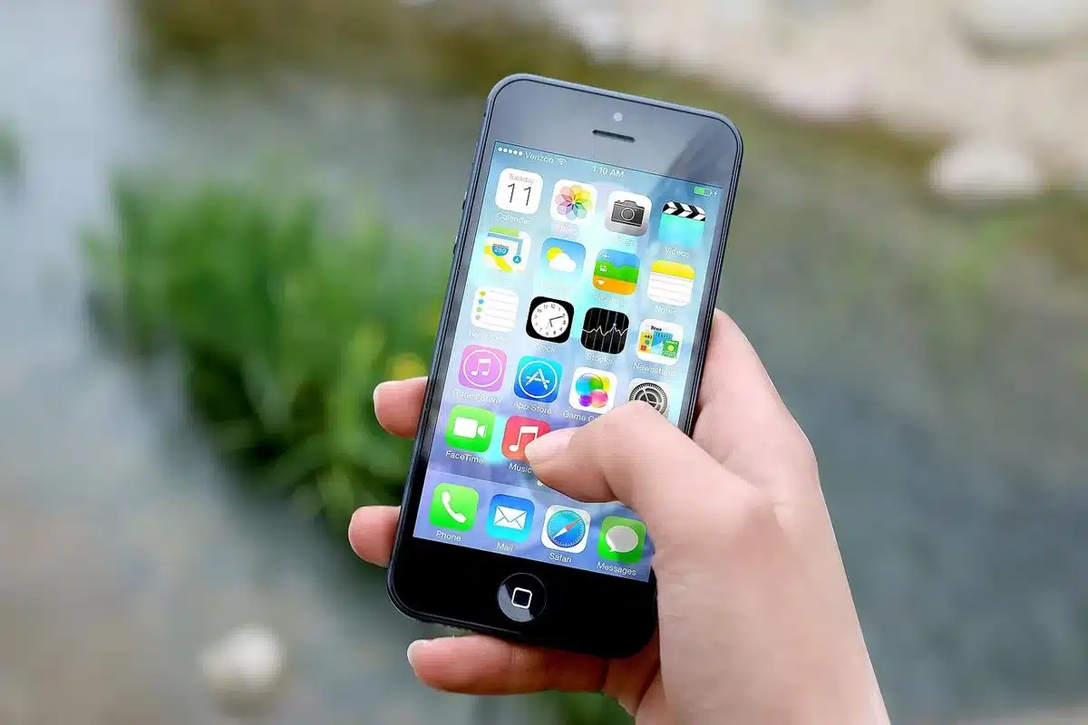 Close-up of a phone screen corner showing camera area and a protector edge