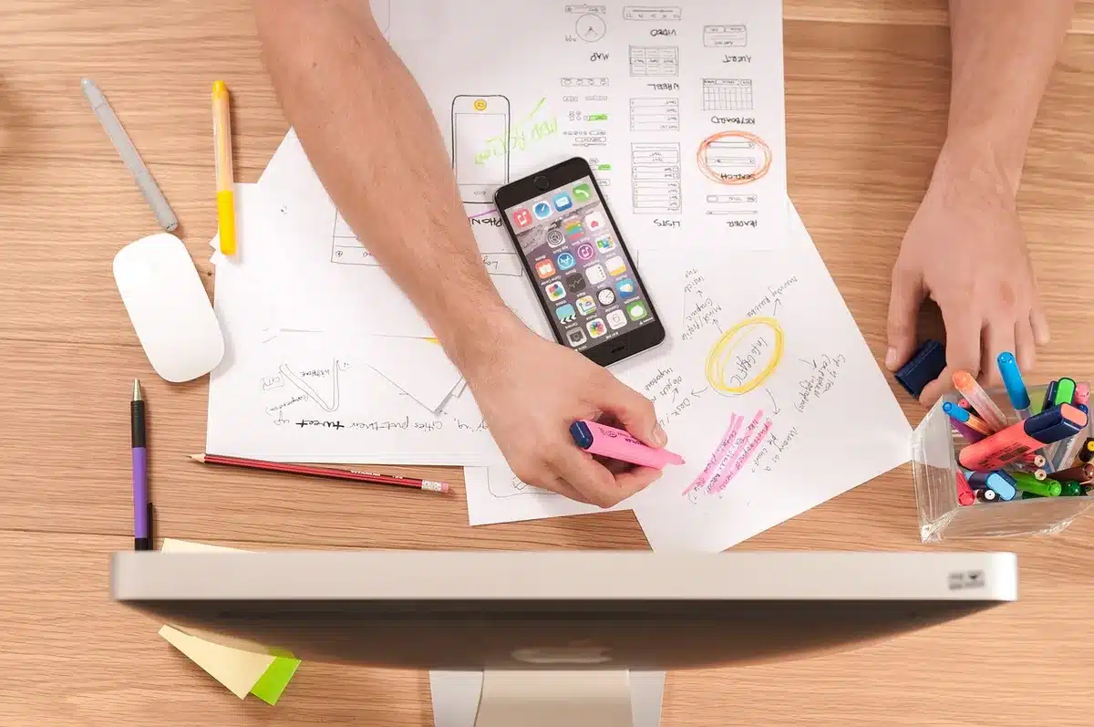 Designer using Figma to create design systems and interactive prototypes