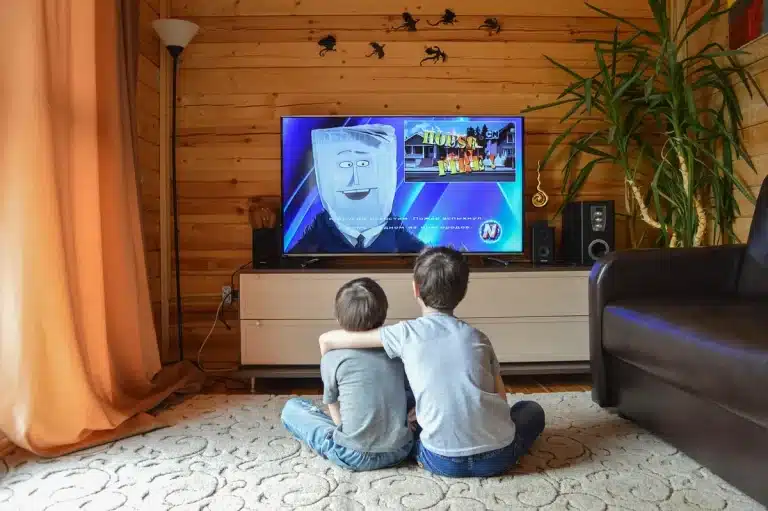Modern living room with a large premium TV displaying bright HDR content and an integrated soundbar