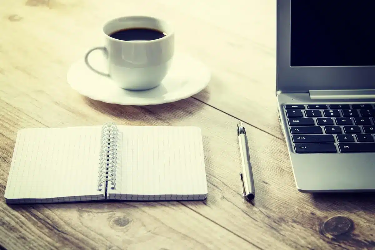 Thin aluminum ultraportable laptop open on a clean desk with soft lighting