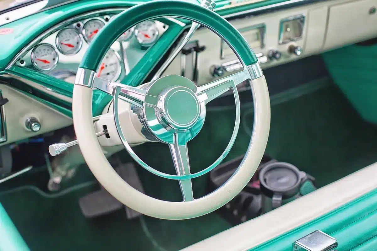 Close-up of an EV infotainment screen and dashboard showing navigation and controls