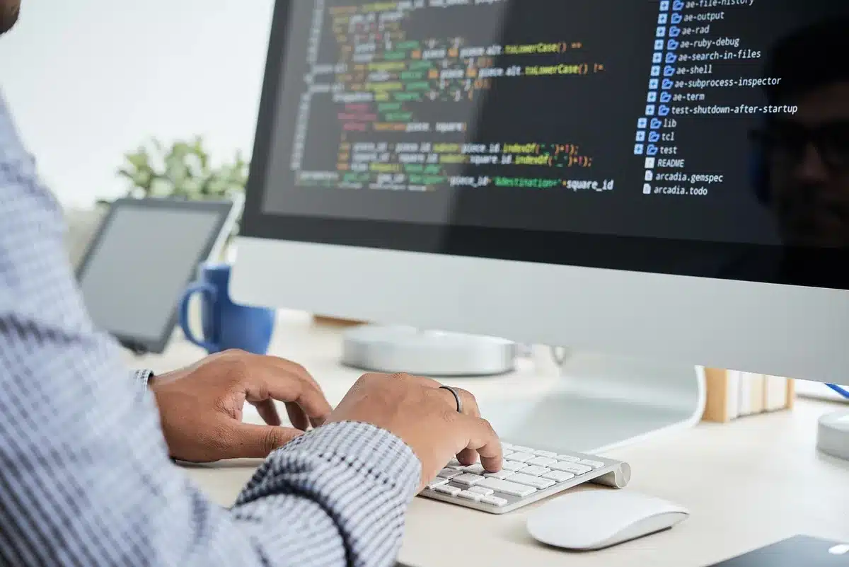 Developers streaming a live build session at a bright office table