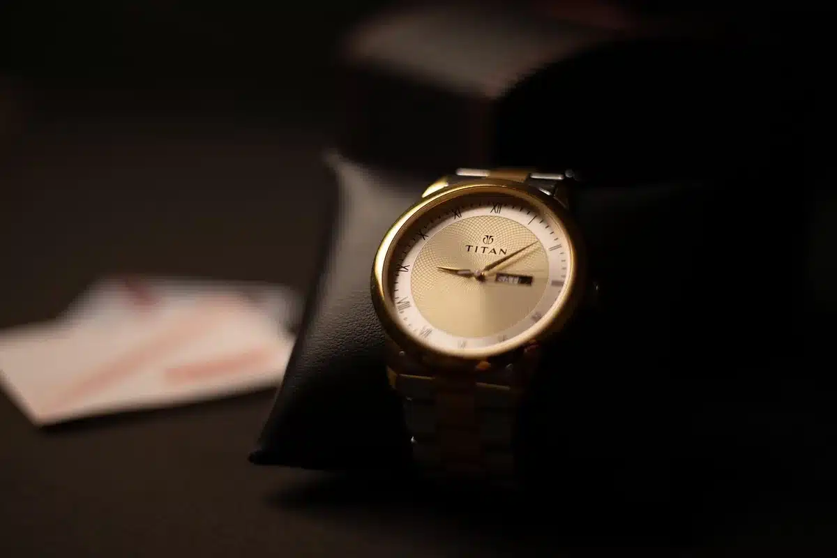 Close-up of a titanium smartwatch on a table with a strap
