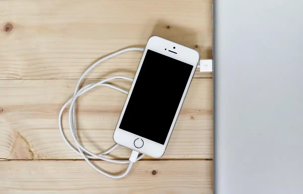 Smartwatch on a charger with battery indicator visible