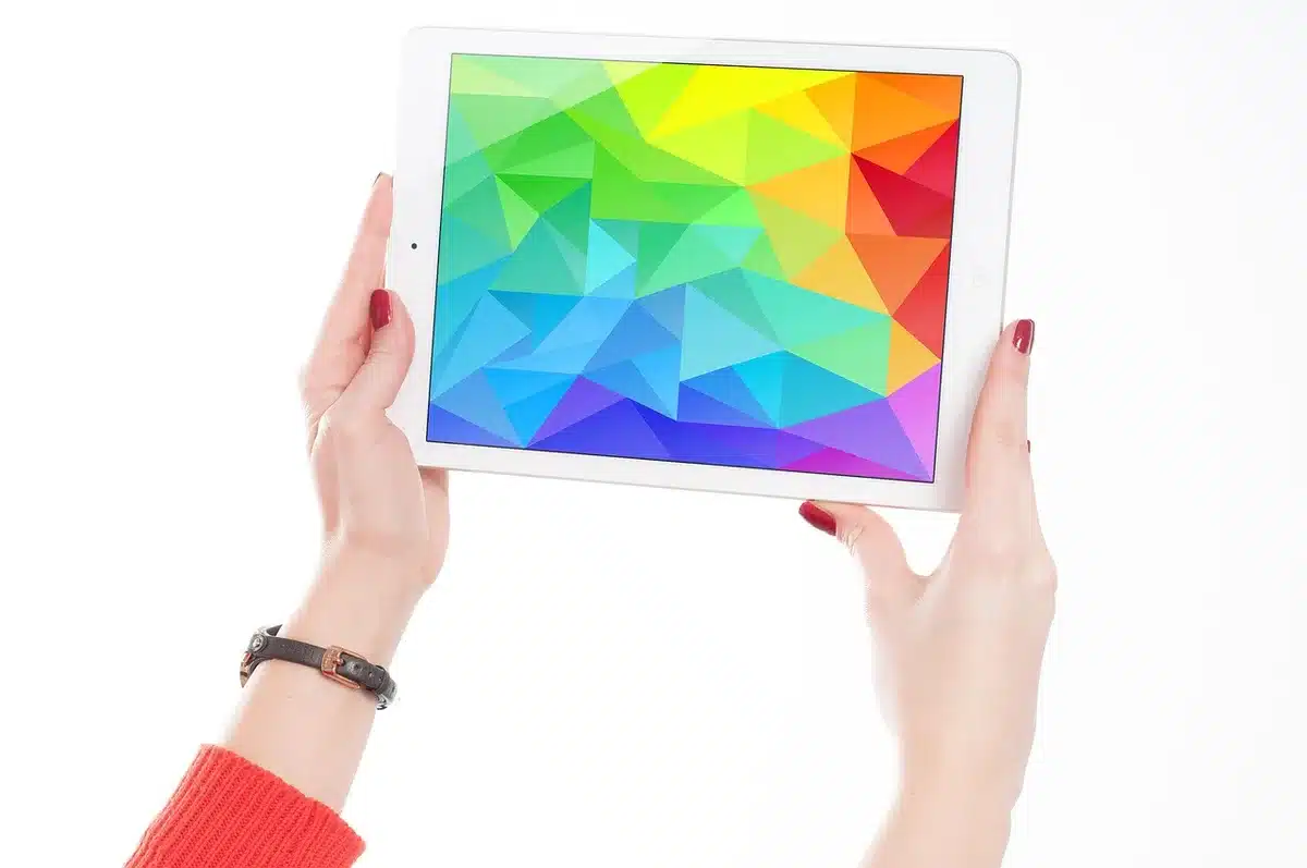 Close-up of an 11-inch tablet screen displaying a vivid home screen