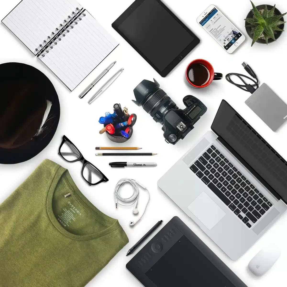 Tablet, stylus and box interior laid out on a desk