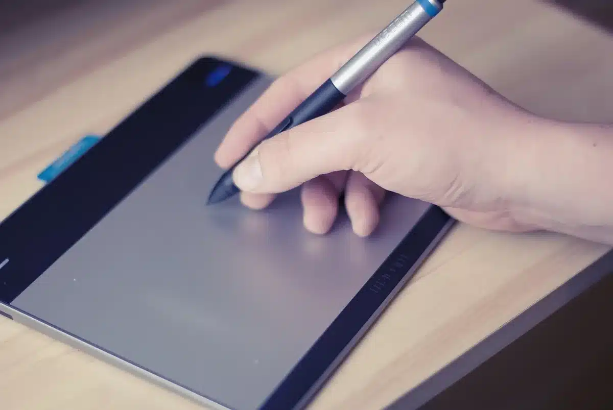 Person using a tablet with a stylus to take notes