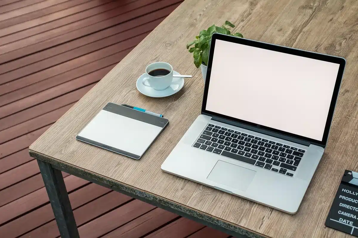 Samsung-style tablet with S Pen on a sunlit study table, notebook nearby