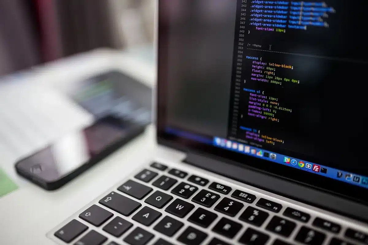 Developer laptop screen with Julia code and plots