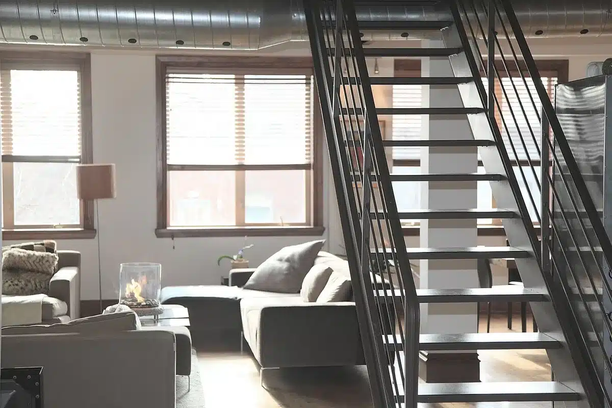 Ultra short‑throw projector image on a plain white wall and a dedicated UST screen