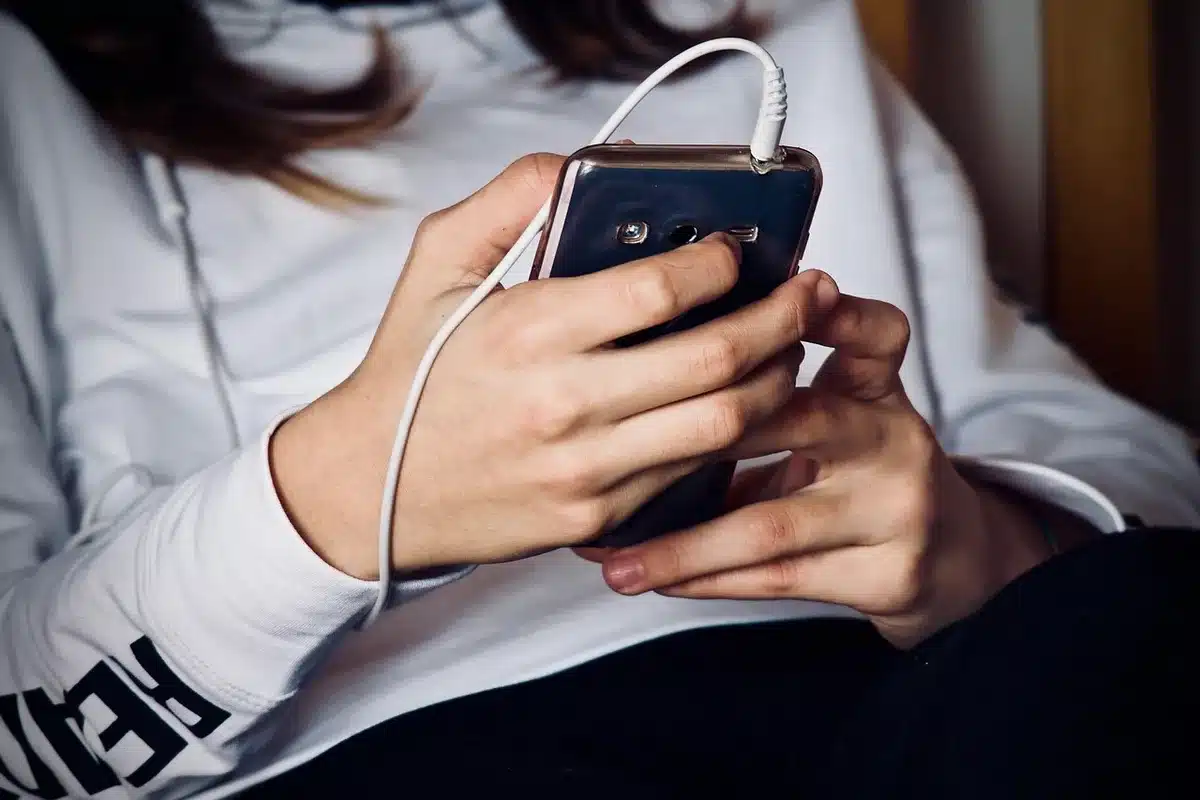 Close-up of a foldable phone hinge on a bright desk